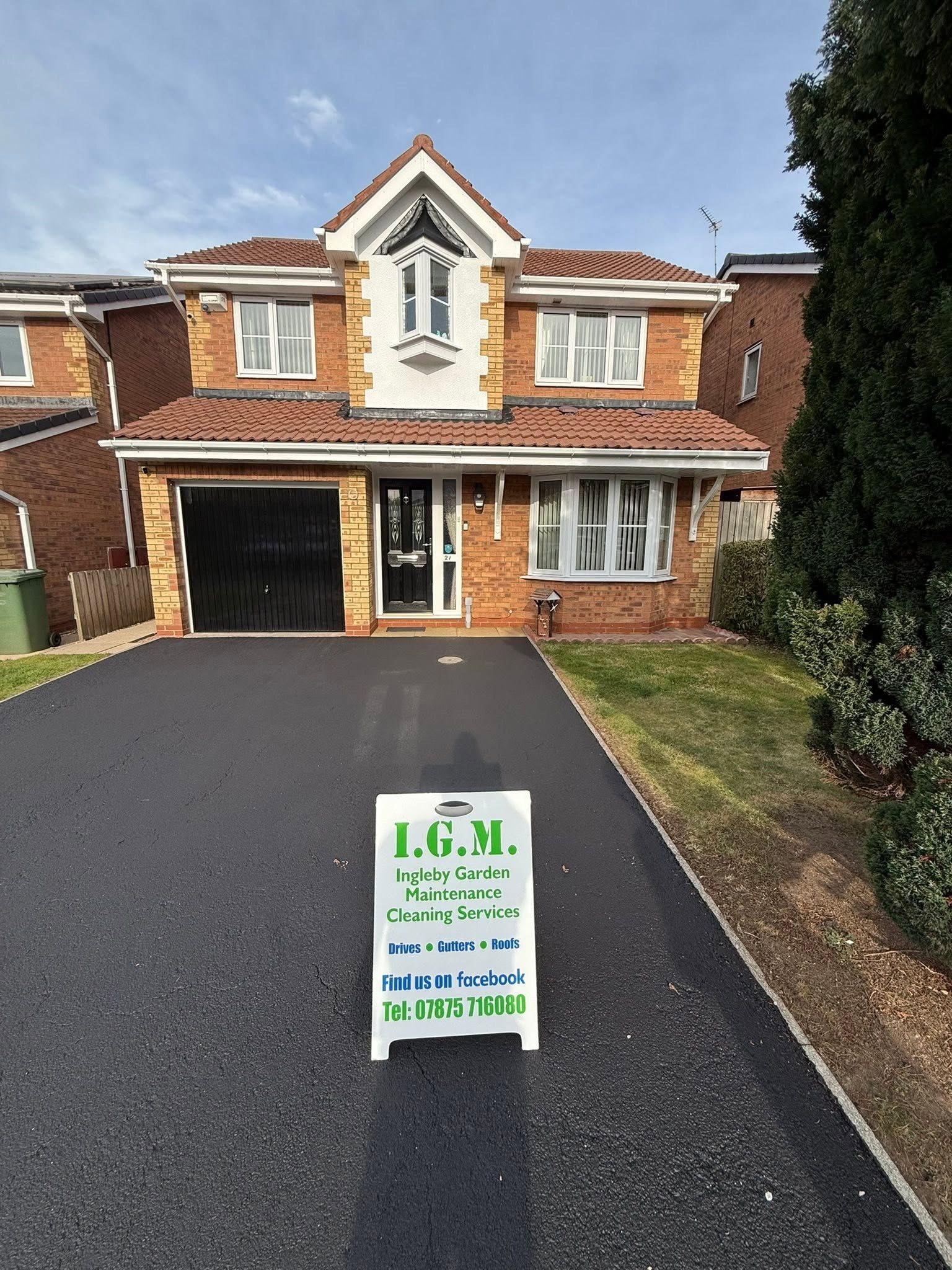 Tarmac driveway with IGM sign board — driveway cleaning in Billingham  Teesside by Ingleby Garden Maintenance (IGM)